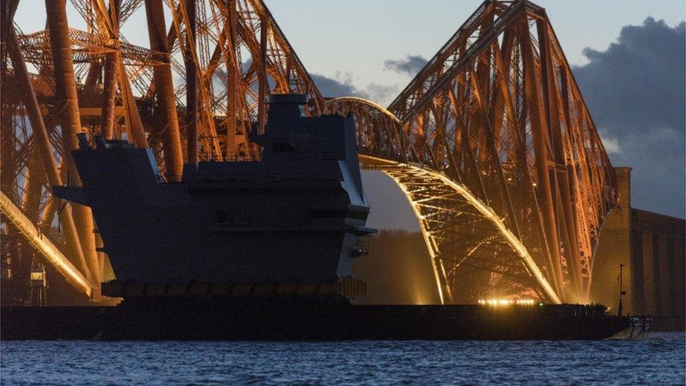 Barge passing under Forth Bridge