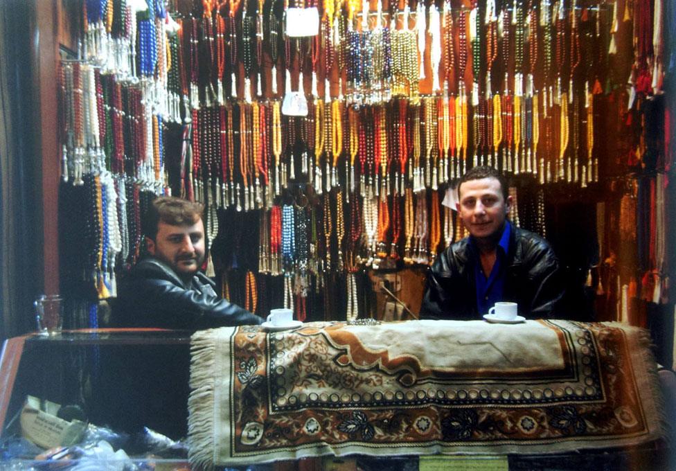 Bead sellers at the souk, before the war