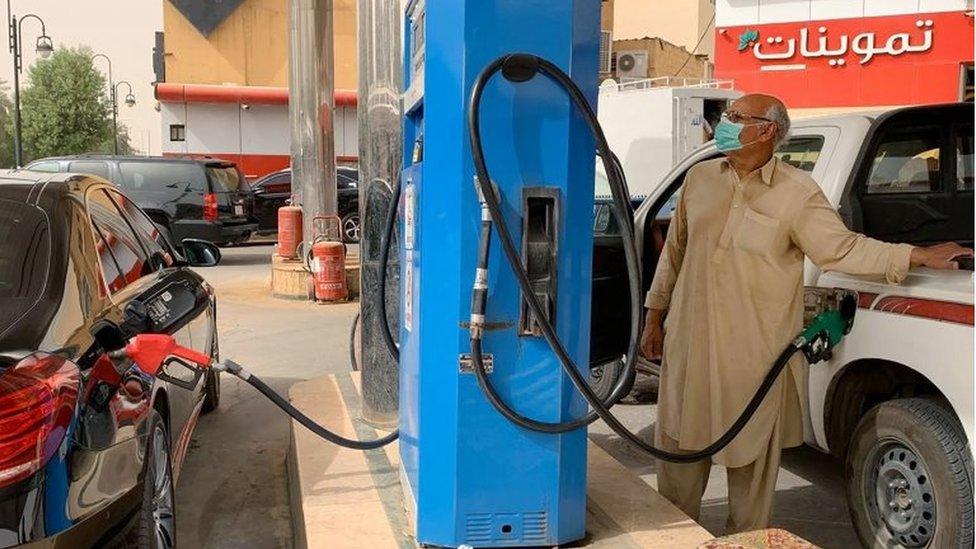 Man filling his car at petrol station in Riyadh (file photo)