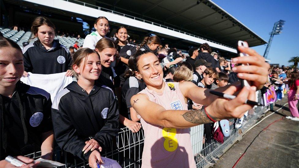 England player Lucy Bronze takes a selfie with a fan in Australia