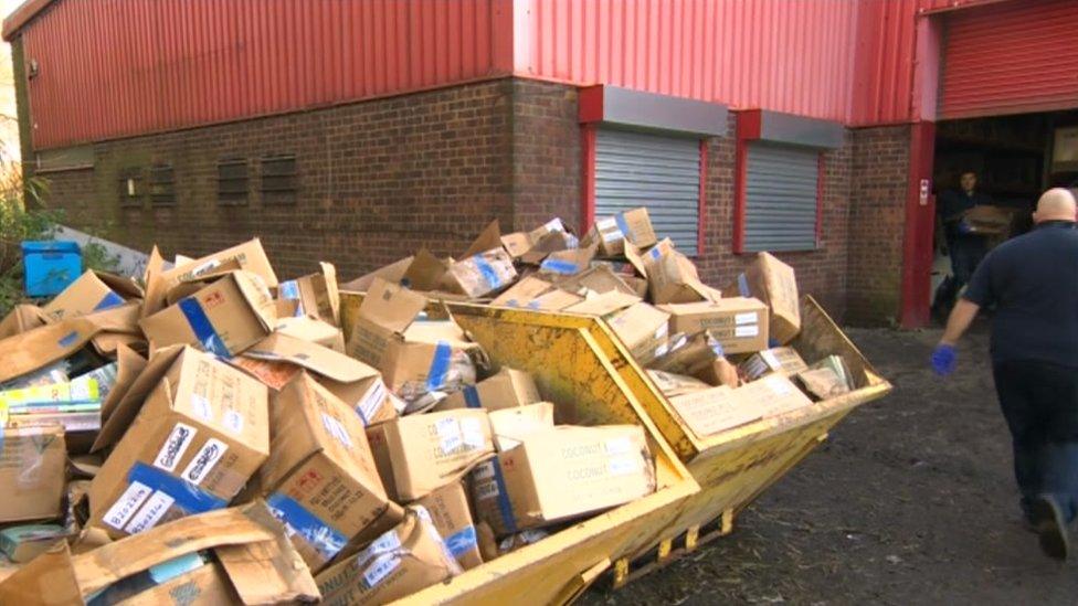 Damaged books in a skip outside of Re-Read