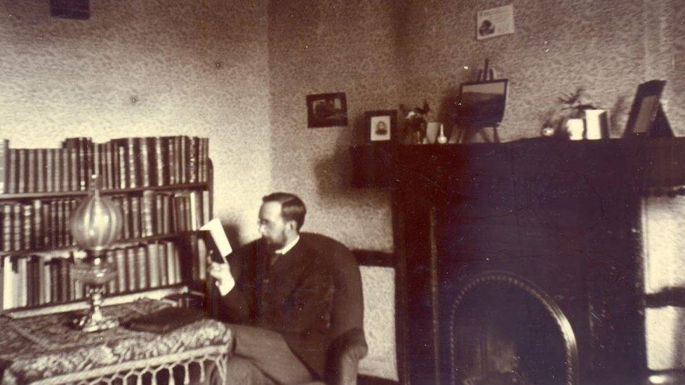 Student in his room, 1900