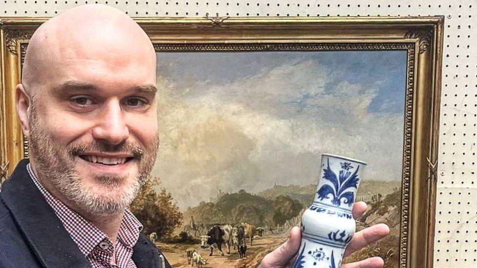 Antique's expert Paul Fox holding the 17th century Chinese vase