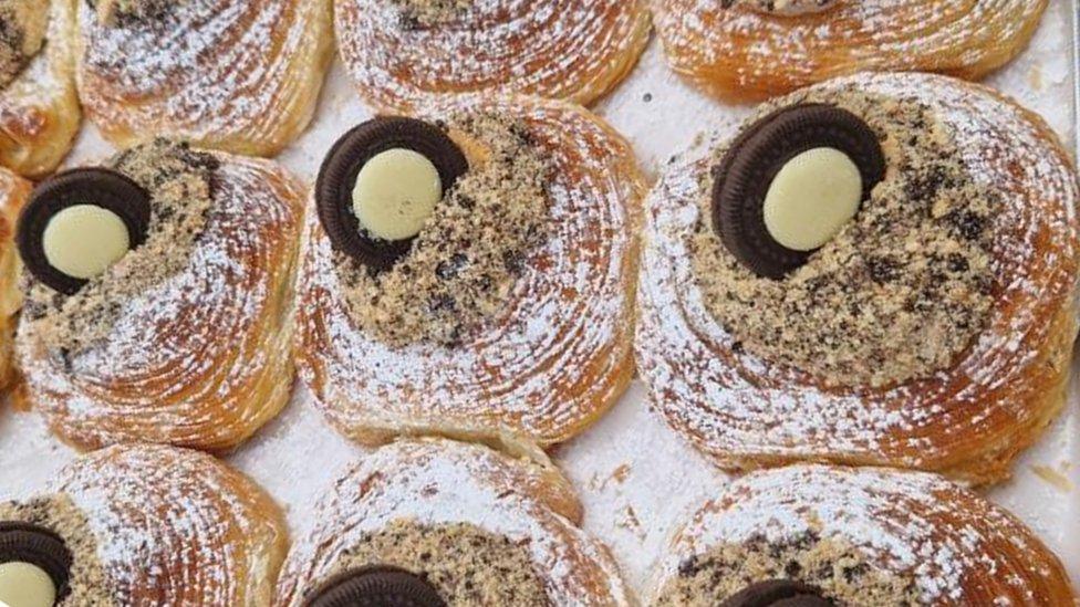 Pastry filled brown biscuit and topped with a chocolate "tyre"