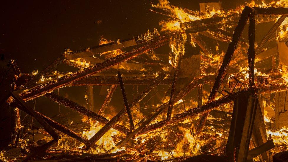 A house burns during the Woolsey Fire in Malibu, California, 9 November 2018