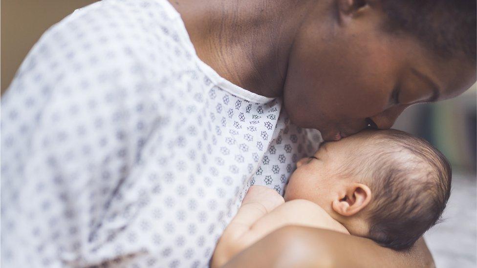 An American mother holds her baby