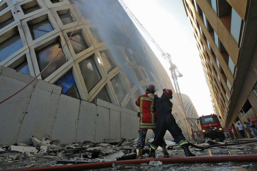 Firefighters douse the flames of a blaze at a landmark modern building in central Beirut, 15 September 2020.