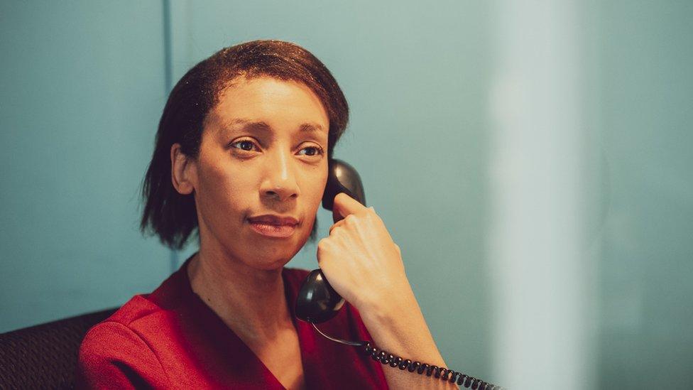 File photo of woman volunteer on phone