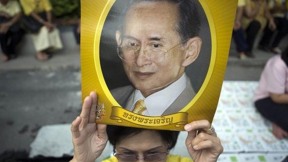 Well-wishers wait outside Siriraj hospital where Thai King Bhumibol Adulyadej is due to leave, in Bangkok 15 September 2014.