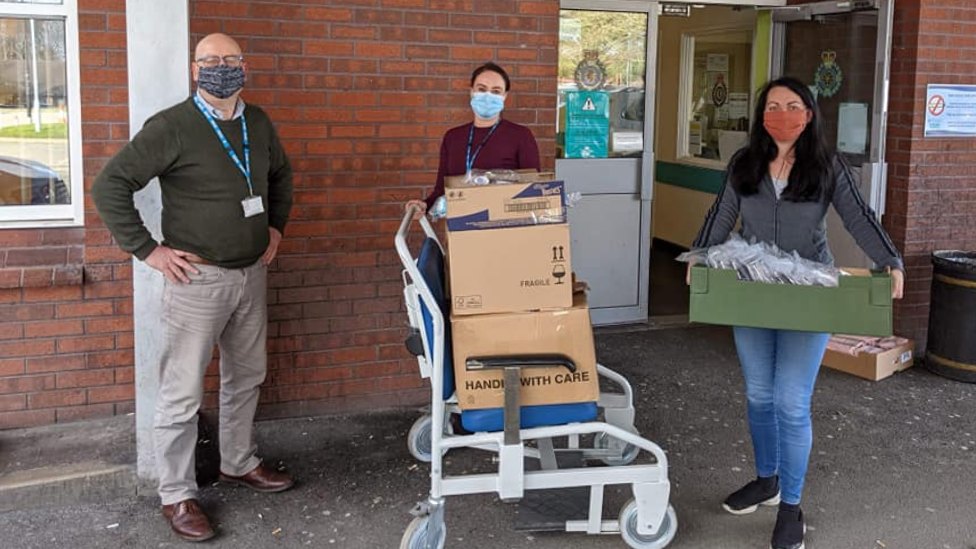 Handing over goody bags to NHS staff