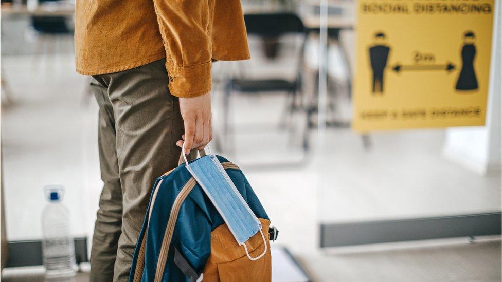 child with bag