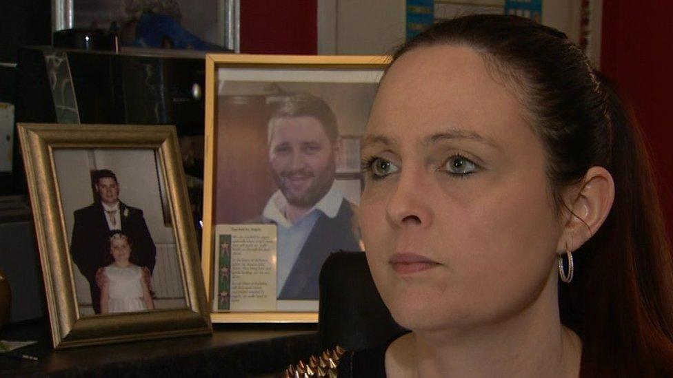 Joanne McGibbon, sitting in front of photographers of her murdered husband