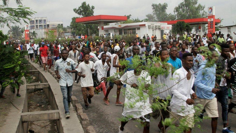 Congolese opposition supporters chant slogans during a march to press President Joseph Kabila to step down