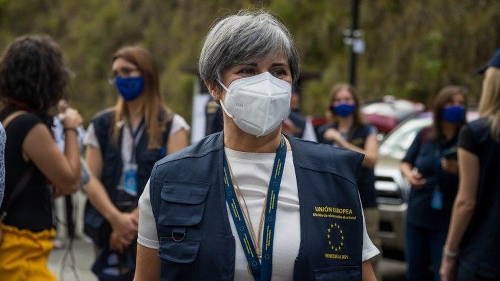 The head of the European Union observation mission (EU-EOM), Portuguese MEP Isabel Santos, awaits with other officials before they go to where they are assigned to observe in Caracas, Venezuela, 18 November 2021