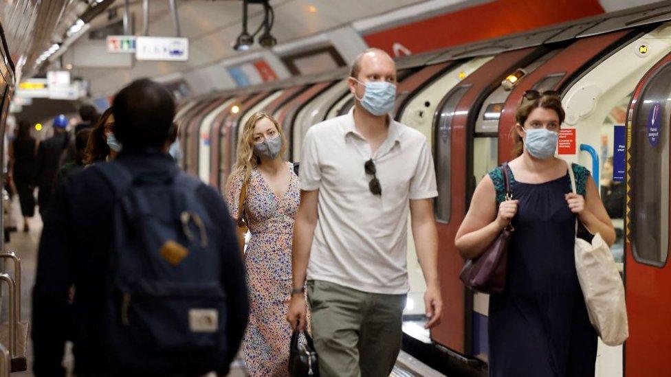 commuters with masks