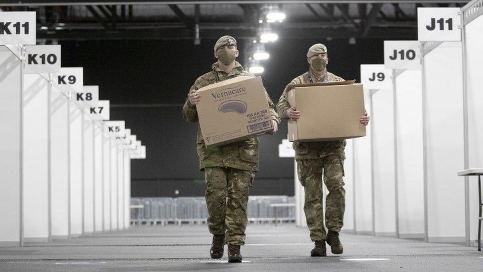 Soldiers setting up vaccination centre