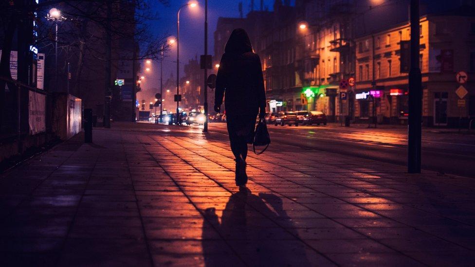 women walking alone at night