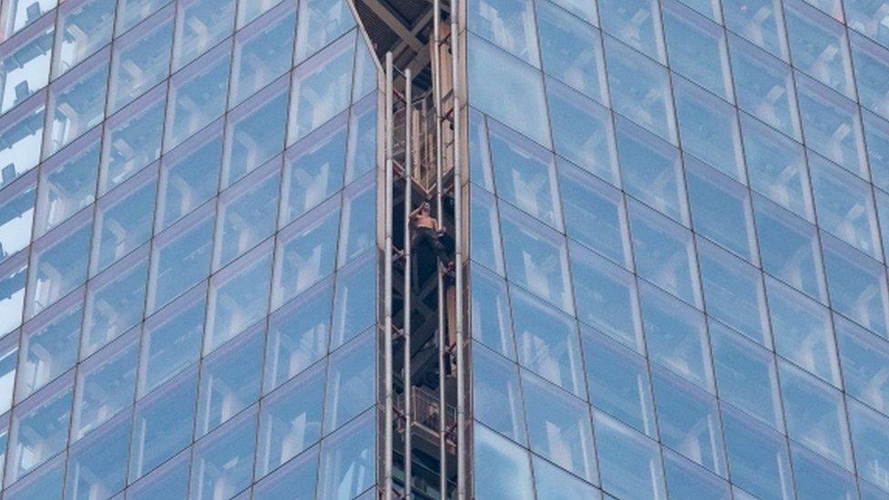 Man climbing The Shard in London