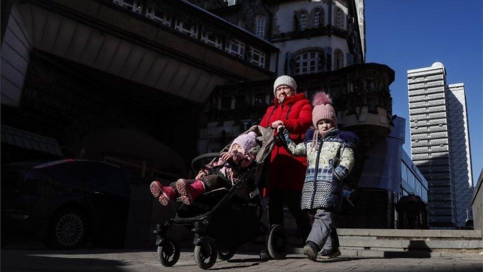 Russian people walk at a street in Moscow, Russia, 01 March 2022