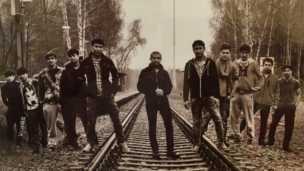 Unaccompanied Afghan migrant boys stand on train tracks in Geithain, eastern Germany (photo by Detlef Rohde)