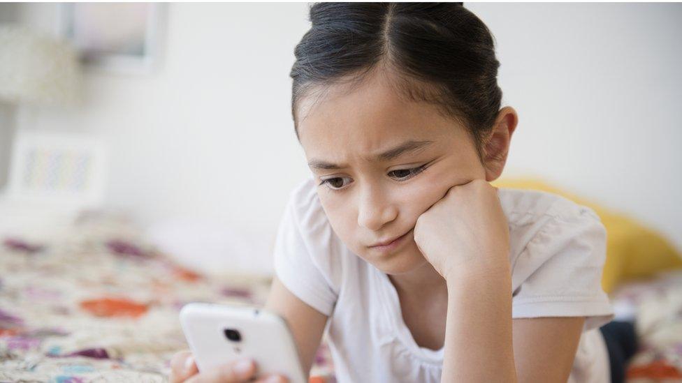 girl looking at phone