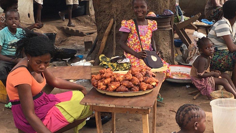 People in Benzvi displaced camp are selling some croissants and other food to earn a living, Bangui, CAR