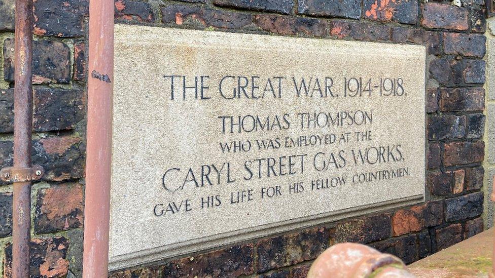 memorial plaque engraved into wall