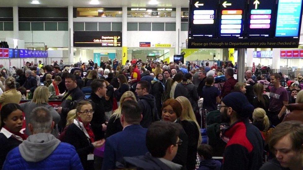 Gatwick Airport passengers queuing at check in