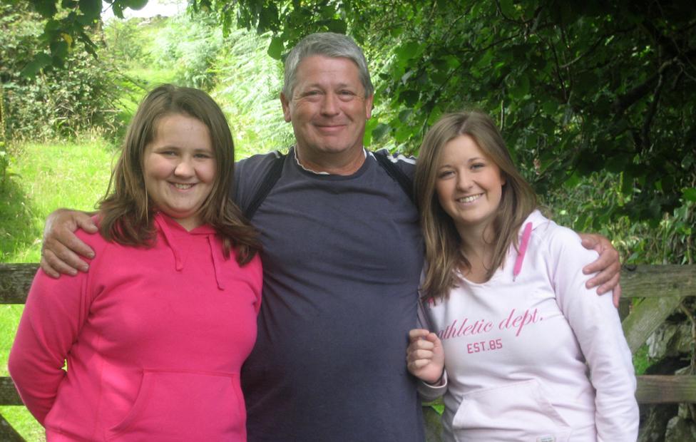 Nigel Hurst with his two daughters