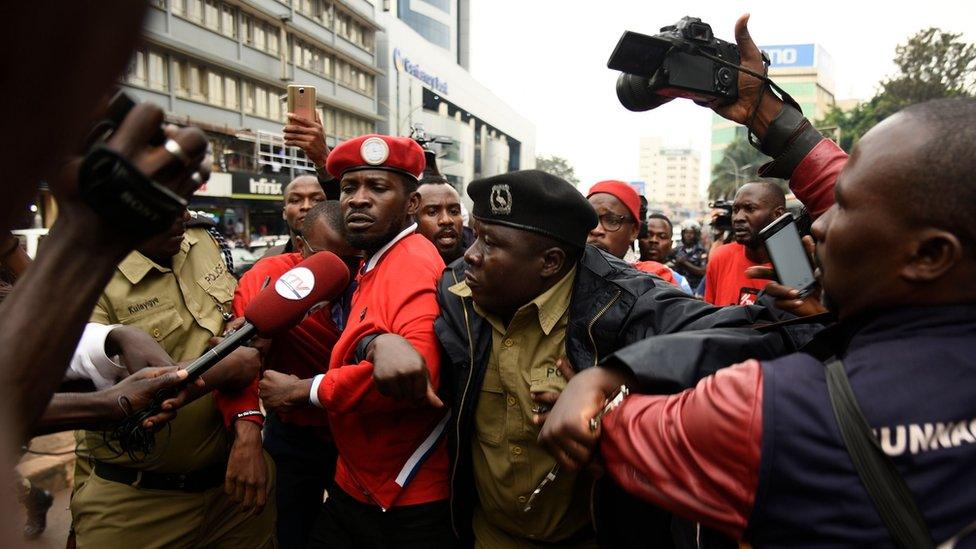 Police taking away Bobi Wine during demo