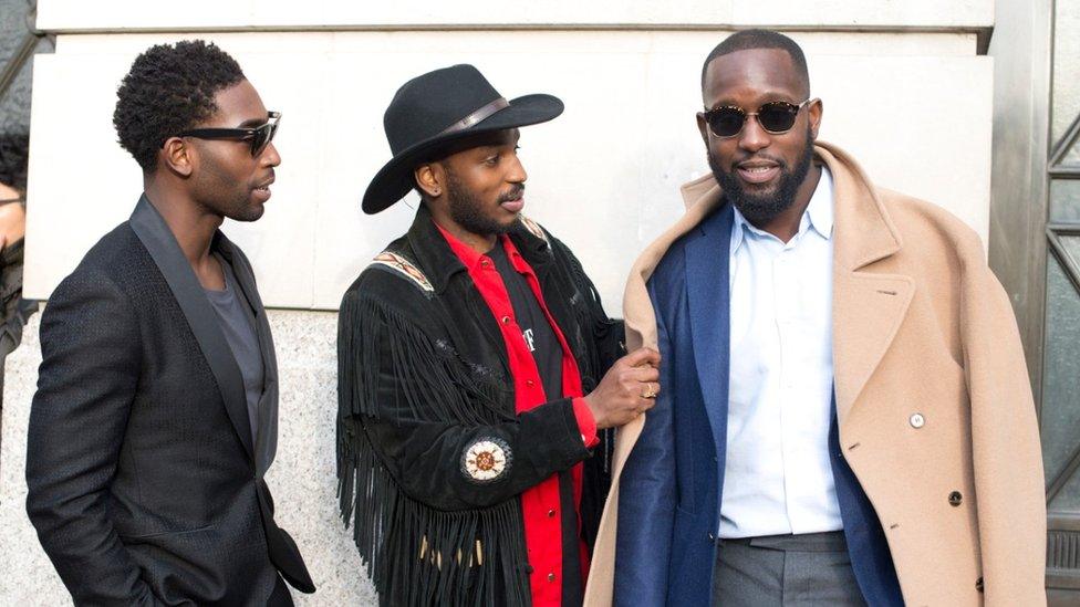 Tinie Tempah wearing a Hardy Amies suit (right)