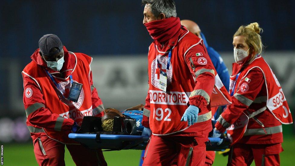 Nigeria striker Victor Osimhen being stretchered off the pitch while playing for Napoli