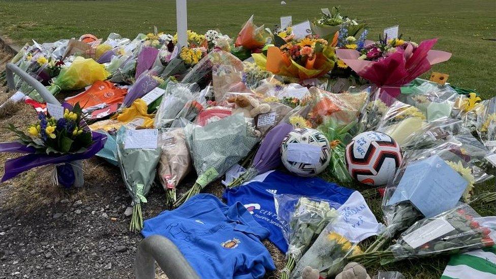 Floral tributes at pitch