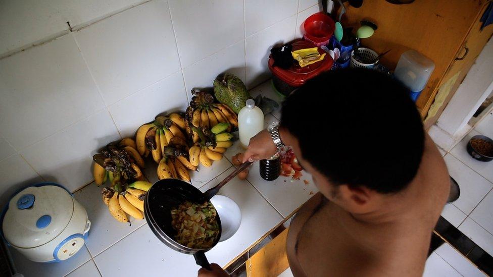 Aditya naked in his kitchen