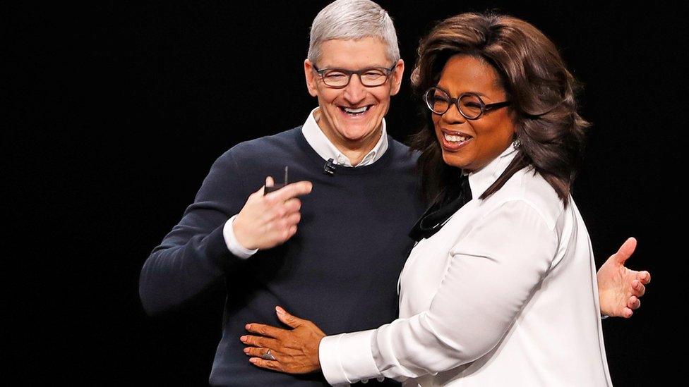 Apple chief executive Tim Cook and Oprah Winfrey