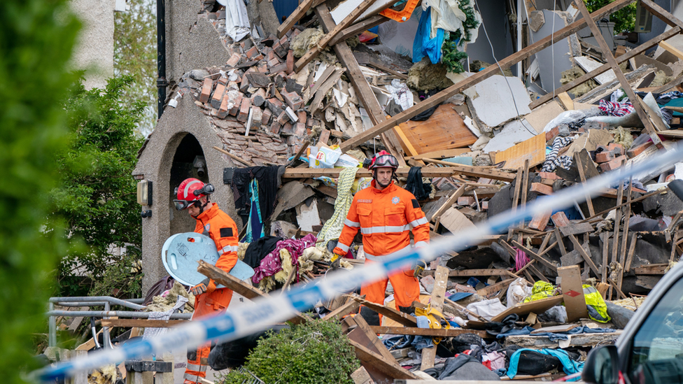 Emergency workers at the scene of the gas explosion