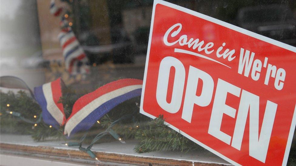 "We are open" sign in Jamestown's main square