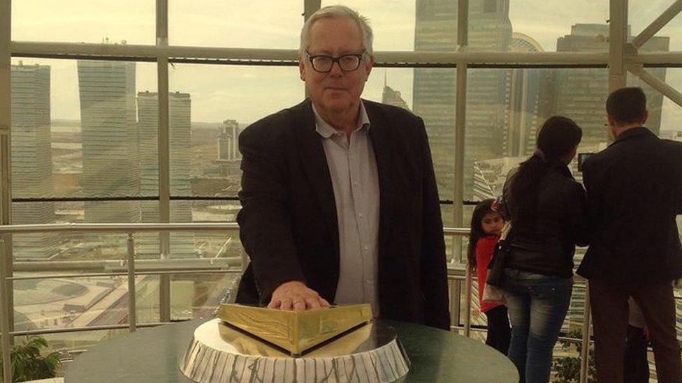 Nazarbayev's hand imprint is displayed at the top of Bayterek Tower that stands the Kazakh capital Astana