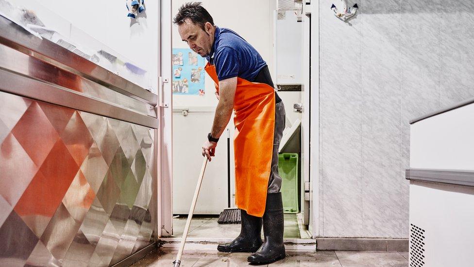 cleaner mopping the floor