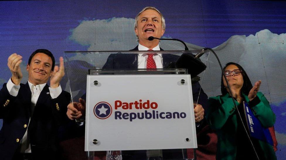 Jose Antonio Kast (C), talks to the press about the victory of his candidates during an election to choose members of a Constitutional Council who will draft a new constitution proposal, at the Republican Party headquarters in Santiago on May 7, 2023.