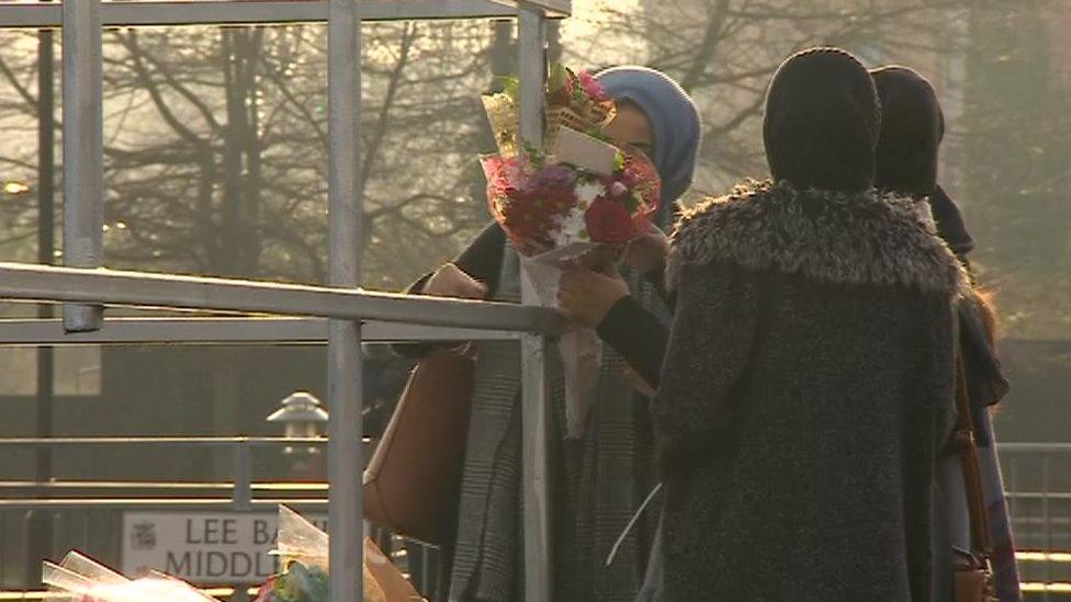 Women leave tributes at the scene of the crash on Belgrave Middleway