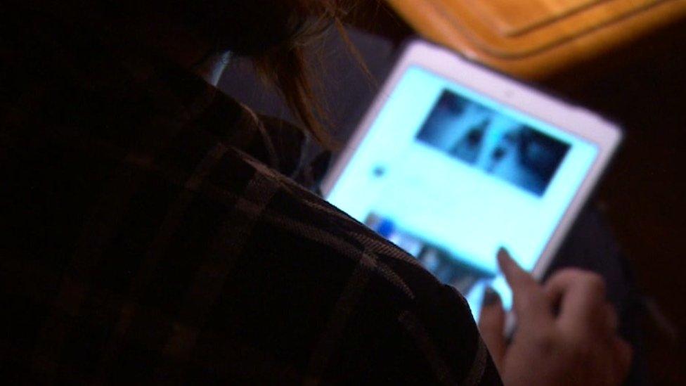 A woman using a tablet computer