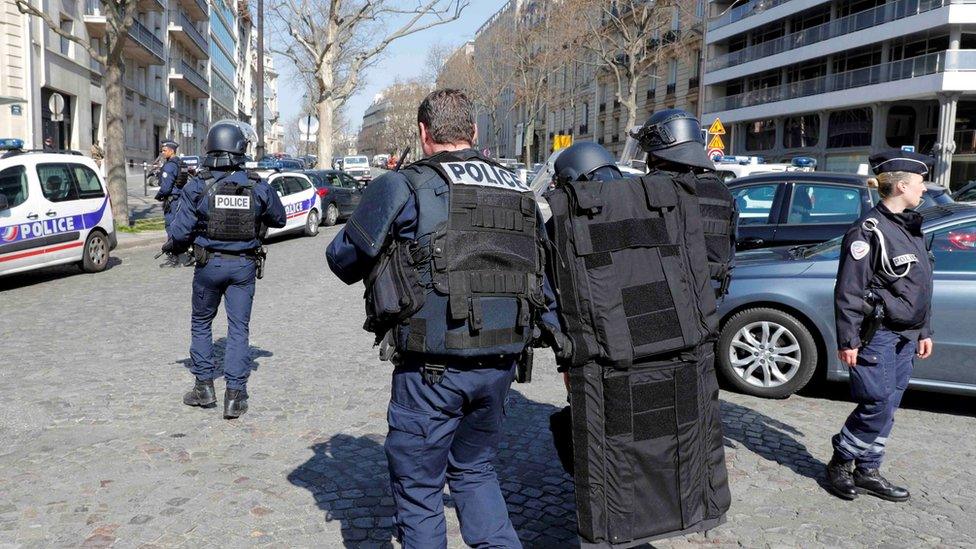 Police outside the International Monetary Fund (IMF) offices where an envelope exploded in Paris, France, 16 March