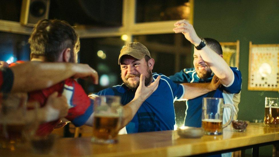 A pub fight, posed by models