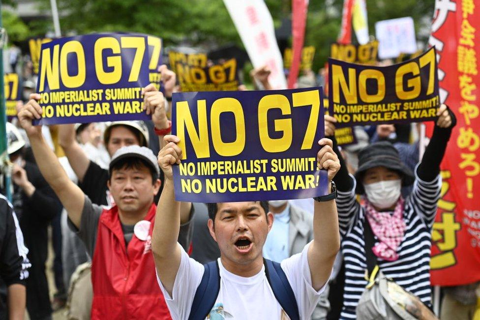 People demonstrate on May 19, 2023 in Hiroshima city, Japan, as they protest against the G7 Hiroshima Summit.