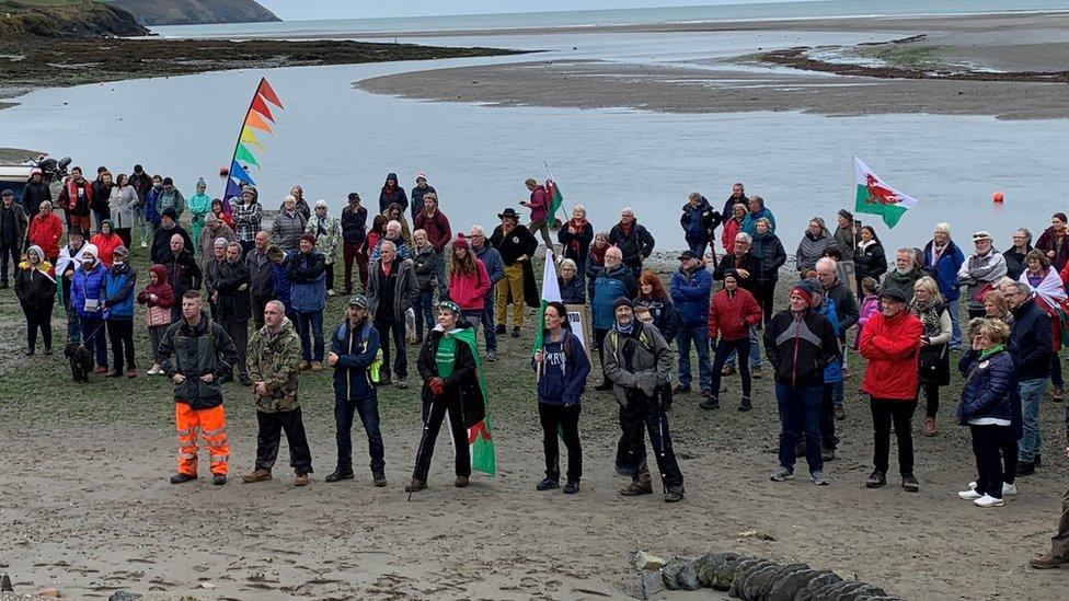 protesters on beach in Newport, Pembrokeshire