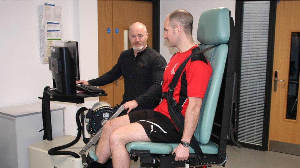 Professor Liam Kilduff and Dr Camilla Knight testing an athlete's leg strength