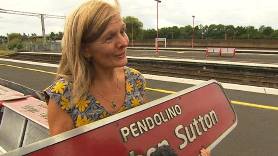 Jane Sutton with the nameplate