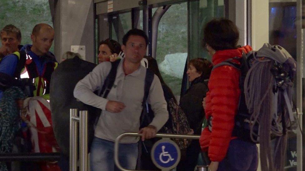 Video image shows rescued passengers arriving at a cable car station in Courmayeur, Italy. 8 Sept 2016