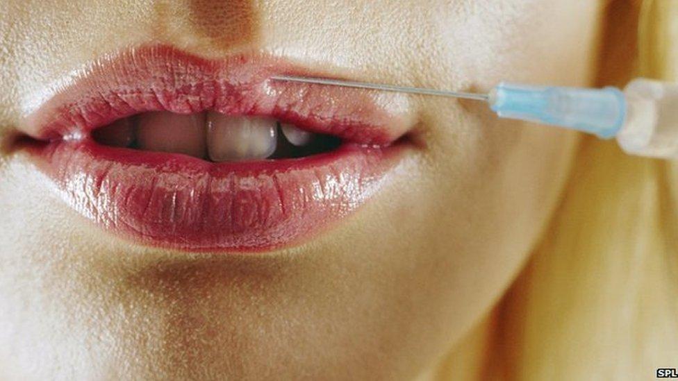 Woman's lips being injected